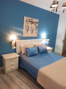 Postel nebo postele na pokoji v ubytování Apartamentos Turisticos Queluz