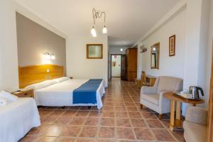 Posteľ alebo postele v izbe v ubytovaní Hotel La Fragua II