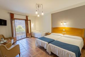 Posteľ alebo postele v izbe v ubytovaní Hotel La Fragua II