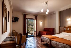 Postel nebo postele na pokoji v ubytování Hotel La Fragua II
