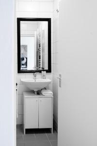 a white bathroom with a sink and a mirror at 5p-home At Best Spot In Town Near Poppodium 013 in Tilburg +29 photos