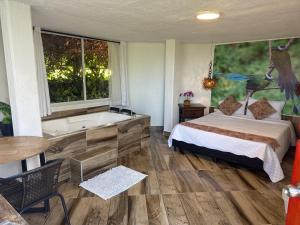 Postel nebo postele na pokoji v ubytování finca turística DanuBio Alojamiento Rural Pereira Risaralda