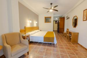 Posteľ alebo postele v izbe v ubytovaní Hotel La Fragua II
