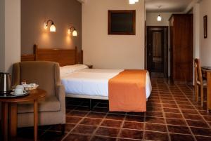 Posteľ alebo postele v izbe v ubytovaní Hotel La Fragua II
