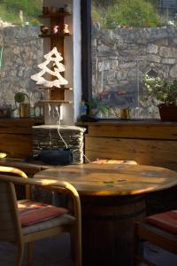 a wooden table with a christmas tree on top of it at Cetina in Ranca