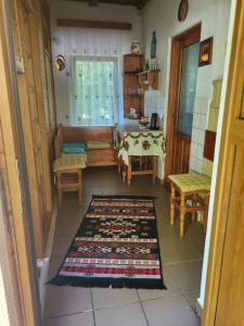 a room with a table and chairs and a table and a table and chairs at Casa Roza in Breaza de Sus +12 photos