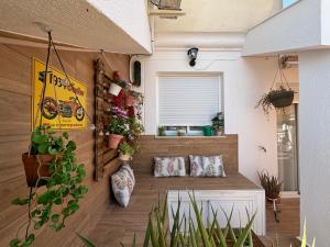 a room with potted plants on the wall at Vivienda turística Jaén Interior ÁTICO in Andújar