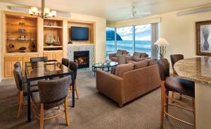 a living room with a couch a table and a fireplace at Worldmark Seaside Condo 2BD in Seaside