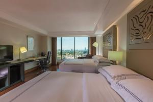 Ένα ή περισσότερα κρεβάτια σε δωμάτιο στο Barcelo Guadalajara