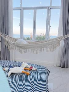 Postel nebo postele na pokoji v ubytování Chang HomeStay Phan Thiết Villa SeaLink&Ocean Vista------------------------------------------------------Căn Hộ Sát Biển-------------Long-Term Rental----------Monthly Rental-------------------------------------------------------GGle CHANG HOMESTAY Mui Ne