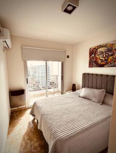 Ένα ή περισσότερα κρεβάτια σε δωμάτιο στο Center Suites