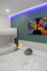 Postel nebo postele na pokoji v ubytování B&B AIDA Rooms Cefalù
