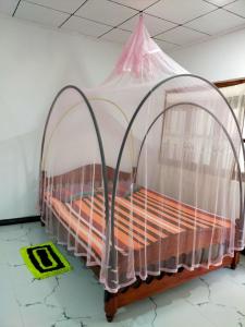 Postel nebo postele na pokoji v ubytování Chandi Gaya Beach Guesthouse