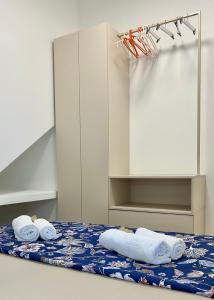 a room with a bed with towels on it at Omis apartment - near beach and town center, ground floor with small garden in Omiš