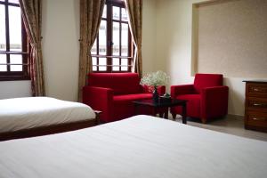 Postel nebo postele na pokoji v ubytování Hùng Phong Hotel - Near Dalat Market
