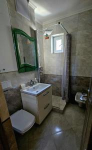 a bathroom with a sink and a shower at Cozy residence in Buzău