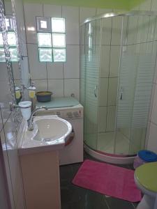a bathroom with a sink and a shower at Villa Katerina Holiday Apartments in Sitia
