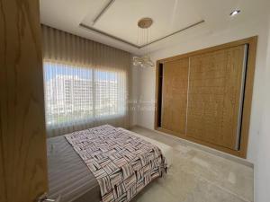 Ένα ή περισσότερα κρεβάτια σε δωμάτιο στο location saisonniere S1 a Sousse