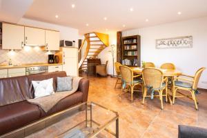 a living room with a couch and a table at Ferienwohnung Birken Allee, 35181 in Schwerinsdorf
