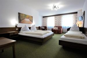 Postel nebo postele na pokoji v ubytování Hotel Urthaler