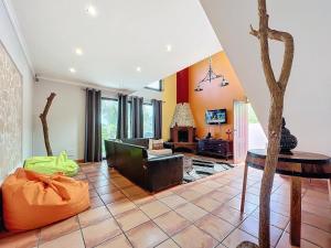 a living room with a couch and a table at Casa da Palmeira in Machico