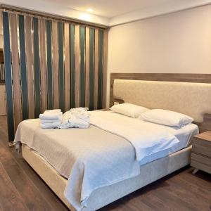 Ένα ή περισσότερα κρεβάτια σε δωμάτιο στο Deluxe Family Apartment 24A