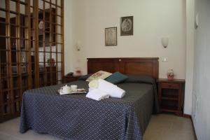 Postel nebo postele na pokoji v ubytování Residence I Due Pini
