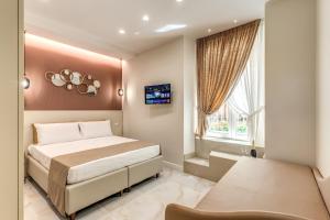 a bedroom with a large bed and a window at Le stanze di Venere in Naples