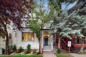 a white house with trees in front of it at Depot Ave - 445 in Telluride