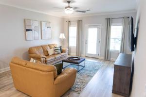 a living room with a couch and a table at Auburn Family Oasis 3 Bedrooms 3 Bathrooms in Auburn