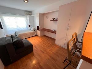 Postel nebo postele na pokoji v ubytování Center Suites Alquiler Temporario