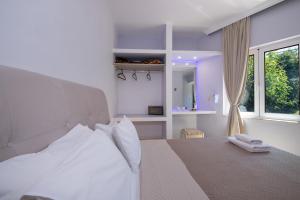 Postel nebo postele na pokoji v ubytování Labyrinth Hotel