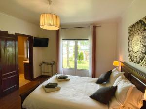 Ένα ή περισσότερα κρεβάτια σε δωμάτιο στο L'Escale au Portugal Villa-B&B-Spa +78 φωτογραφίες