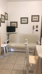 a hospital room with two beds and a phone at APPARTAMENTO LIDO 1 in Alghero