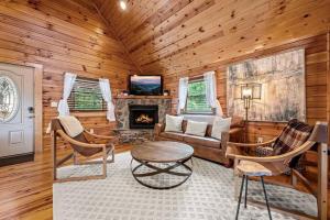 a living room with a couch and a fireplace at Pvt Pool at The Grotto in Sevierville