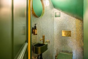 a bathroom with a sink and a mirror at Three Bedroom Chalet Lemon Pit Chamonix in Chamonix
