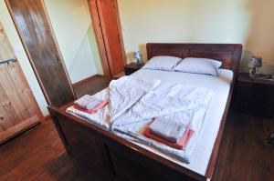 Postel nebo postele na pokoji v ubytování Casa Storia & Casa Antica
