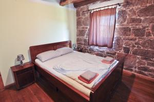Postel nebo postele na pokoji v ubytování Casa Storia & Casa Antica
