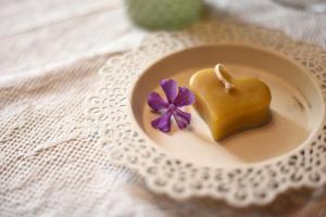 a small dessert in a bowl with a purple flower at Harzglück in Thale