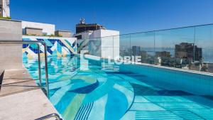 a swimming pool on the roof of a building at Lobie Skylux in Rio de Janeiro
