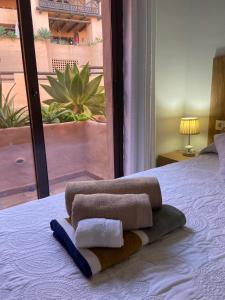 Postel nebo postele na pokoji v ubytování Oasis Coto Real apartments + 40 fotografií