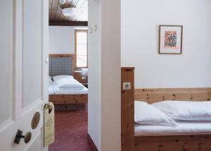 Rúm í herbergi á Gasthof Post