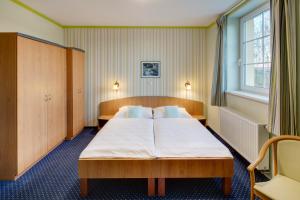 Krevet ili kreveti u jedinici u okviru objekta Hotel Kolonie