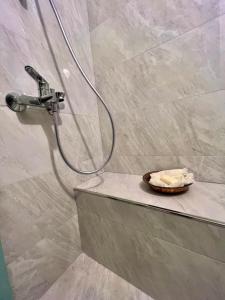 a shower with a towel on a counter in a bathroom at Konak Maksem in Bursa +67 photos