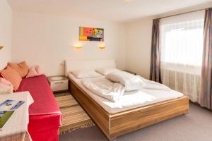 Postel nebo postele na pokoji v ubytování Haus Edmund