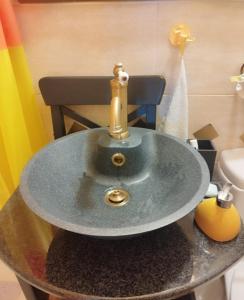 a sink on top of a table in a bathroom at Studio apartman Karmen in Varaždin Breg
