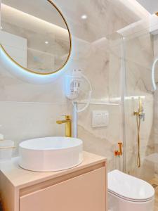 a bathroom with a sink and a mirror at Zace Studios in Ksamil