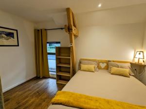a bedroom with a bed and a book shelf at Gîte Le Cerbillona- Gavarnie, France in Gavarnie