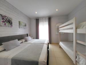 Ένα ή περισσότερα κρεβάτια σε δωμάτιο στο bellazaira