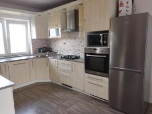 Kuchyňa alebo kuchynka v ubytovaní Apartmán Pavlík